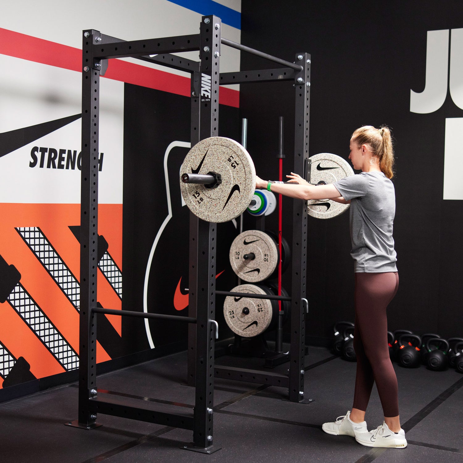 Nike athlete Nelly Korda preparing to lift using the Nike Squat Cage
