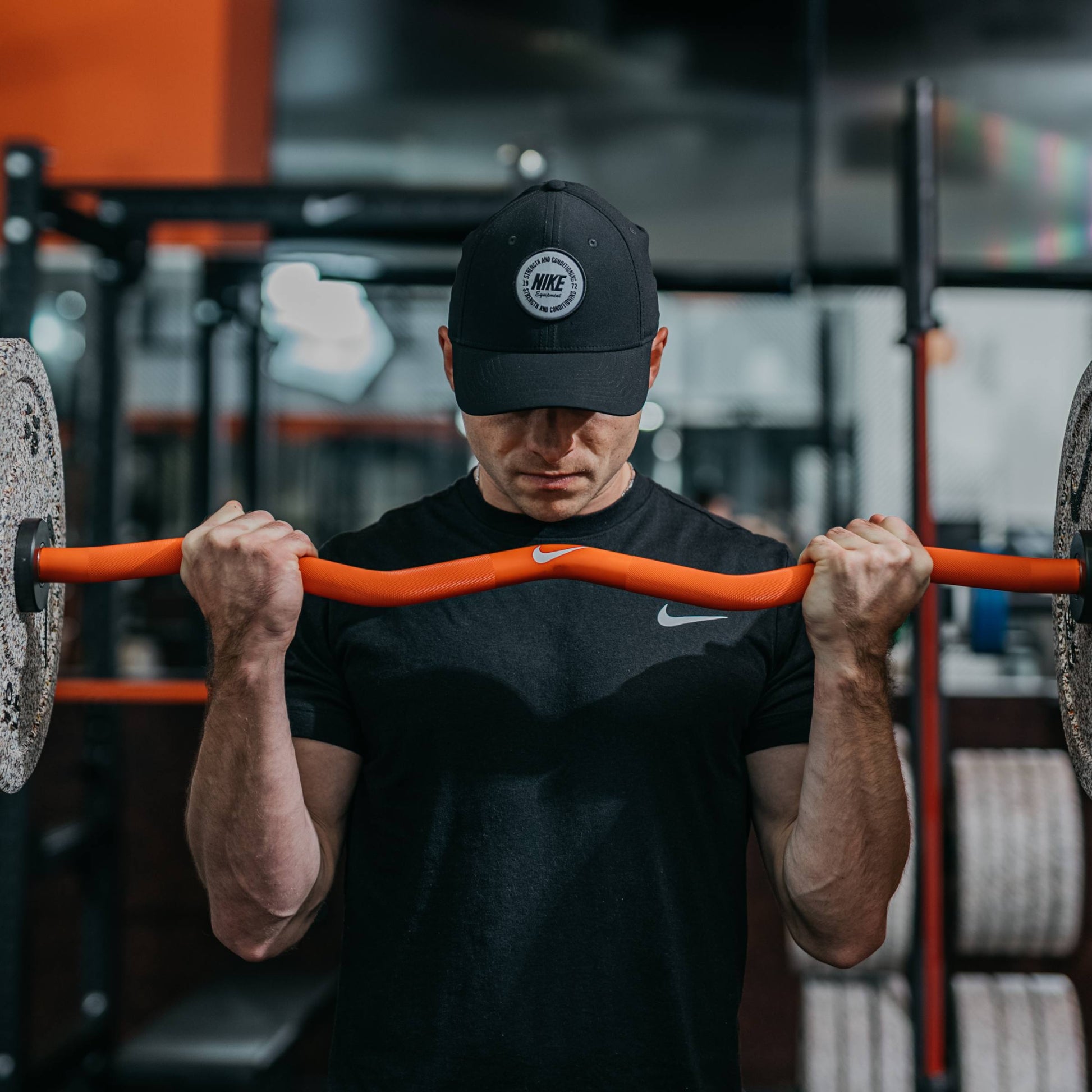 Nike Strength Shield Curl Bar - Orange Swoosh / Nike Black Bumper Plates (10 and 15 lb pairs) / White/Orange