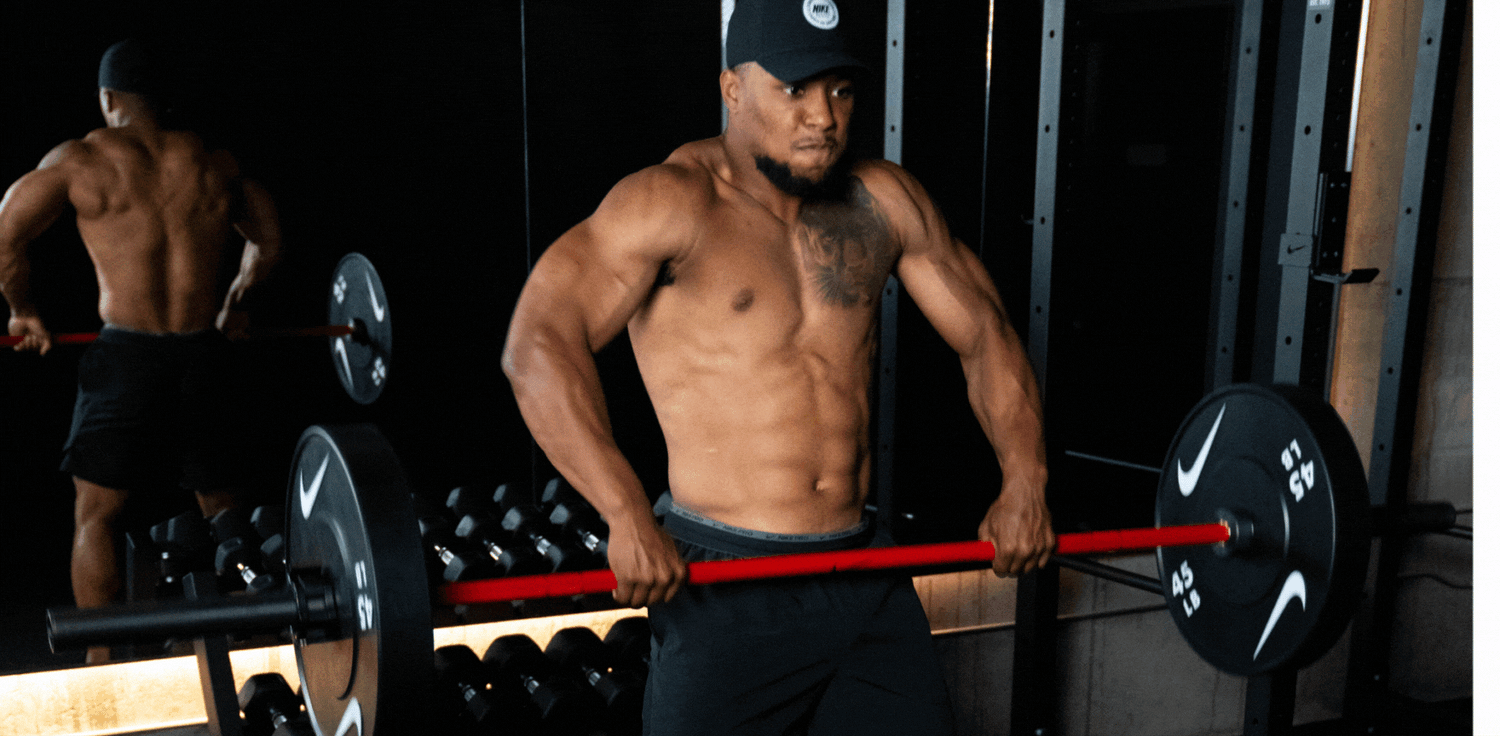 GIF of nike athlete Saquon Barkley hang cleaning as the Nike Coated Premium Barbell 20kg rotates in his hands