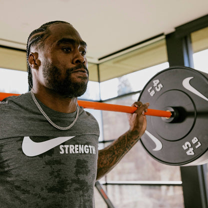 20 kg Nike Strength Shield - Black ("Just Do It") / Nike Black Bumper Plates / White/Orange | 20 kg Nike Strength Shield - Black ("Just Do It") / Nike Black Bumper Plates / Black/Orange | 20 kg Nike Chrome Swoosh / Nike Black Bumper Plates / White/Orange | 20 kg Nike Chrome Swoosh / Nike Black Bumper Plates / Black/Orange