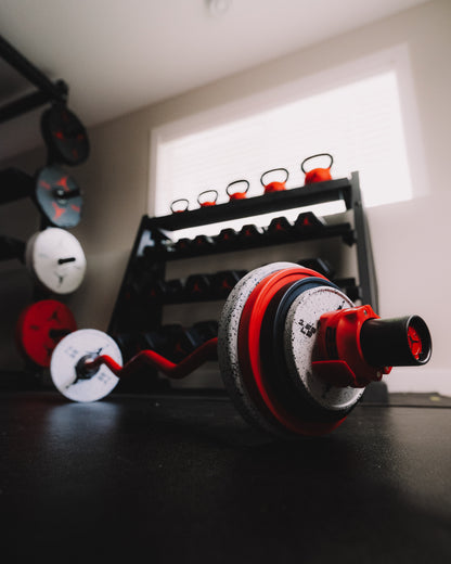 Jordan Strength Curl Bar loaded with change plates and a collar | Jordan Strength Change Plates (1.25 - 10 lb pairs)